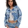 HUGO Blue Lou Cropped Denim Jacket In Midwash Blue With All Over Logo Print For Women 1 HUGO Blue Lou Cropped Denim Jacket In Midwash Blue With All Over Logo Print For Women -HUGO Sales 206889449 1 blue